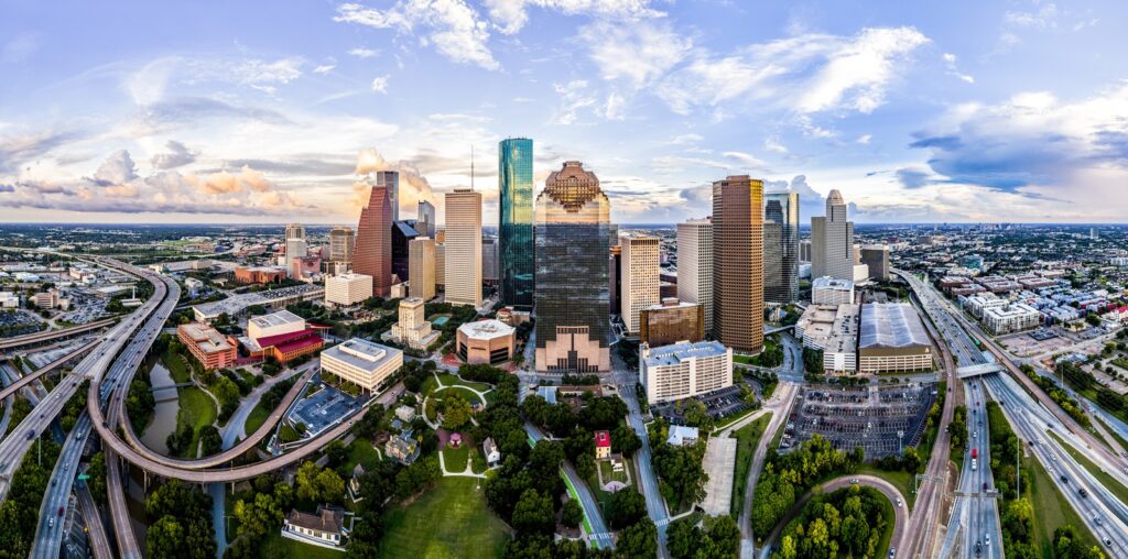 Ariel cityscape view of downtown Houston Texas with park in foreground.